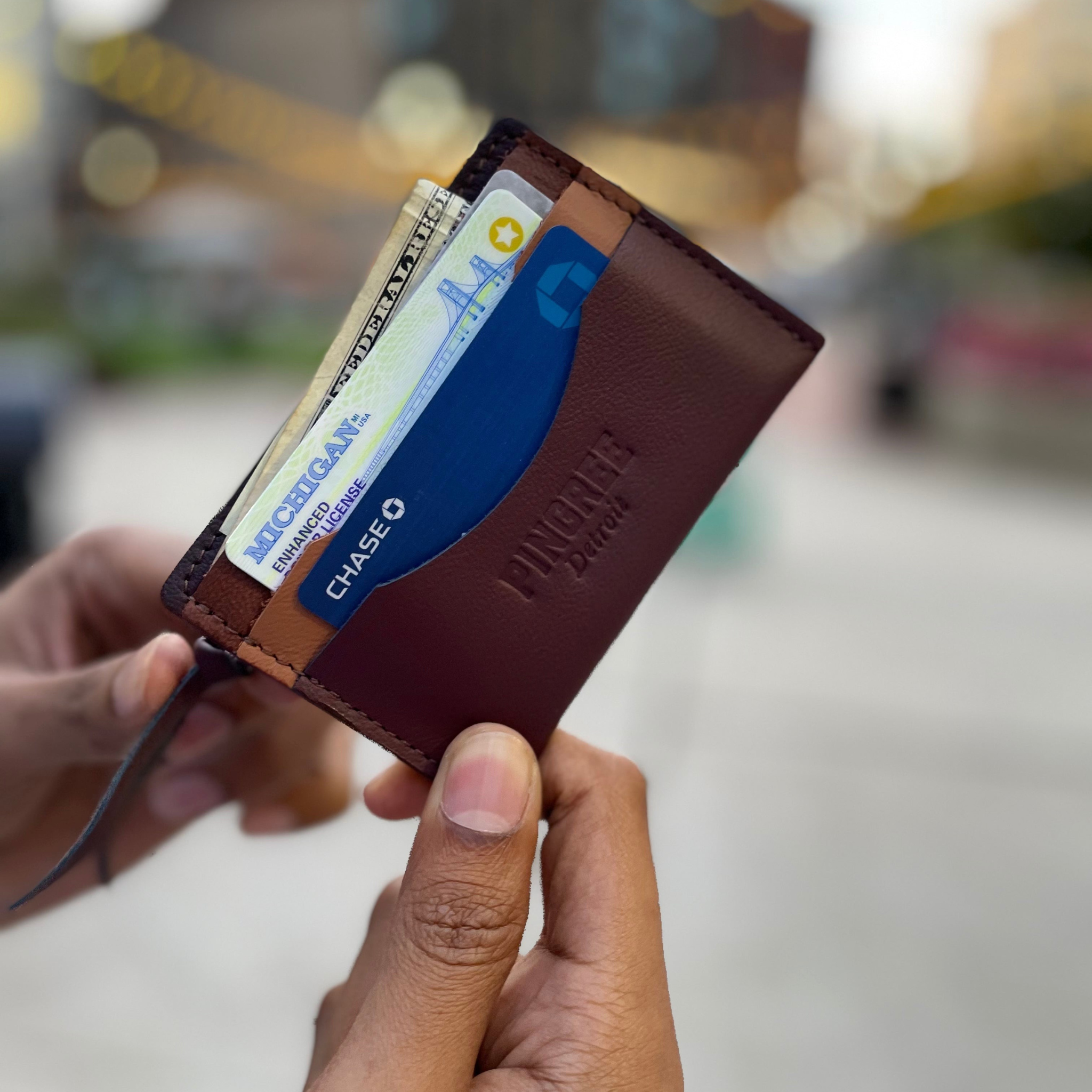 A simple, minimalist, durable, leather wallet that holds up to 8 credit cards and includes a rear zipper. Cash fits perfectly folded once in the top slot. All materials are upcycled from the automotive industry or American-made.