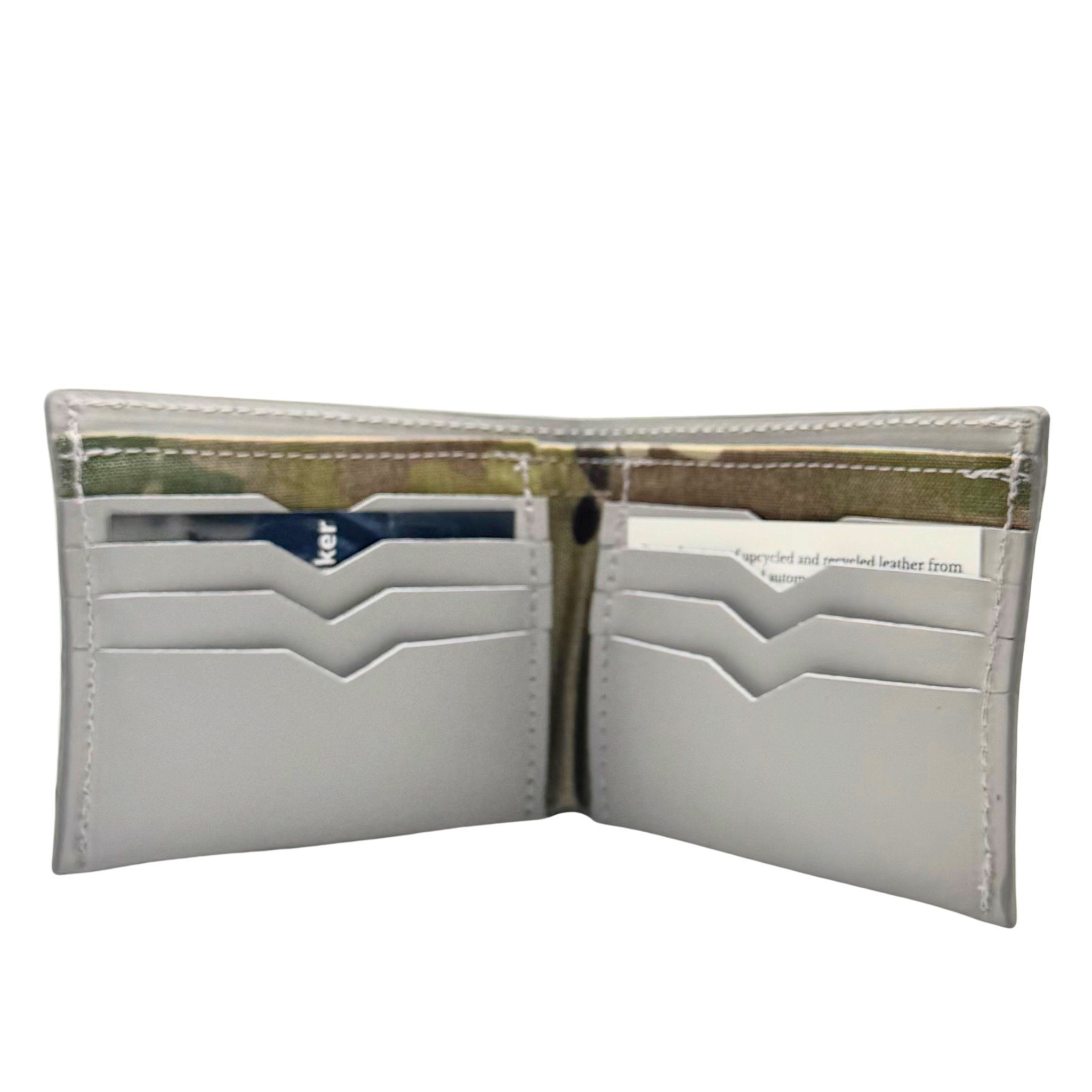 Petoskey stone billfold wallet, pictured here closed. big enough for George Costanza, 10 pockets, leather upcycled from the production of new cars, handmade in Detroit by U.S. Veterans and Detroiters. Liner made from upcycled material from the production of Army tents.