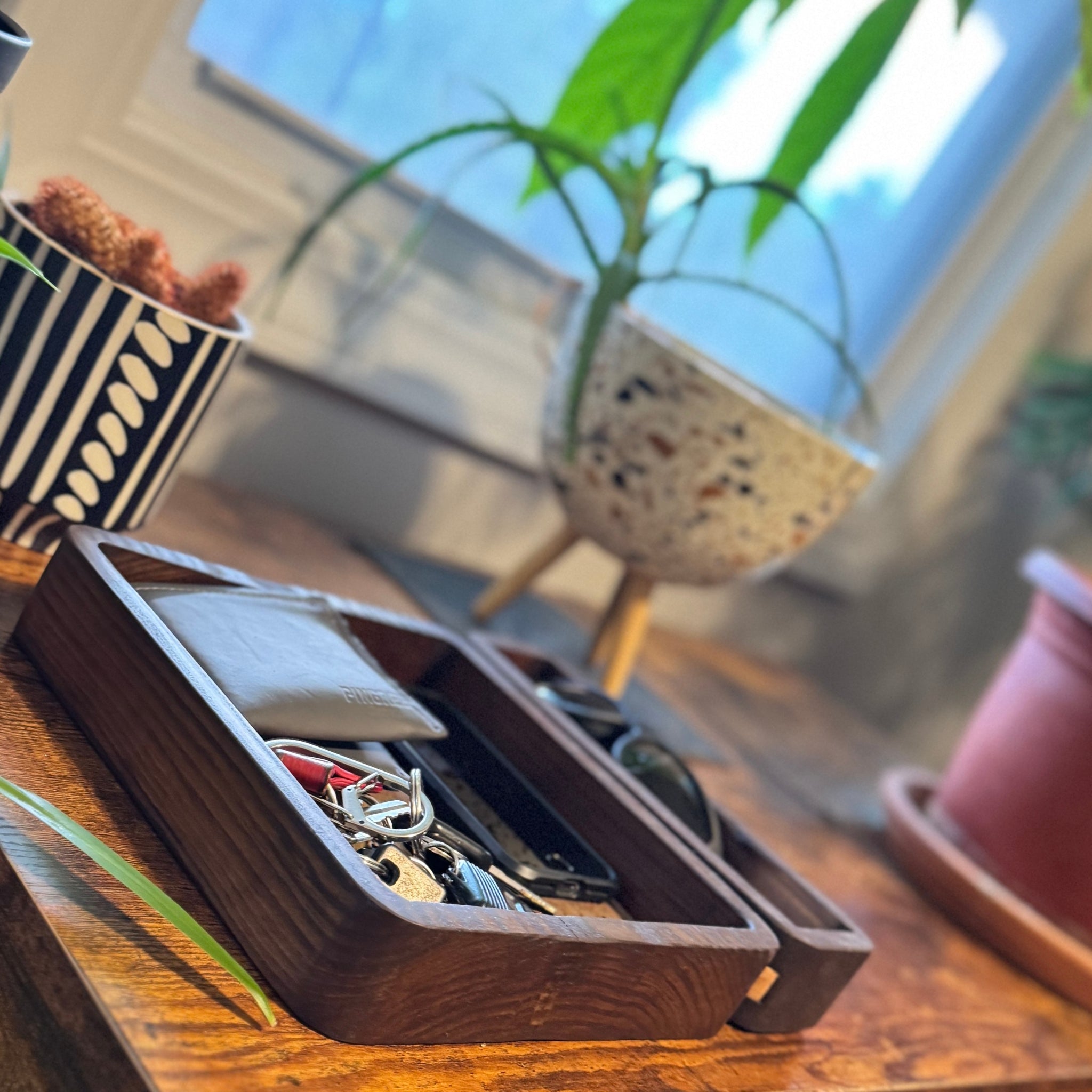 Rustic modern valet tray handcrafted from reclaimed Detroit wood and car leather, designed to organize essentials like keys, phones, and jewelry in your home entryway or dresser.