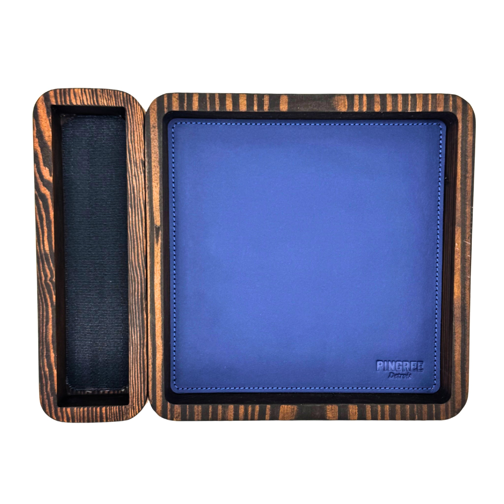 Desk organizer tray, or a dice tray, pictured from above in Blue, handmade in Detroit with reclaimed wood and leather, includes removable watch and jewelry holder — ideal for executive gifts, office storage, or hotel amenities. A look at our TTRPG dice tray, with the blue leather pad, removable wooden dice holder, this modular dice tray is great for during a game. This is a DnD accessories for
Dungeons and Dragons tray,
RPG dice organizer
custom dice tray handmade
upcycled leather gaming gear
eco-friendly T