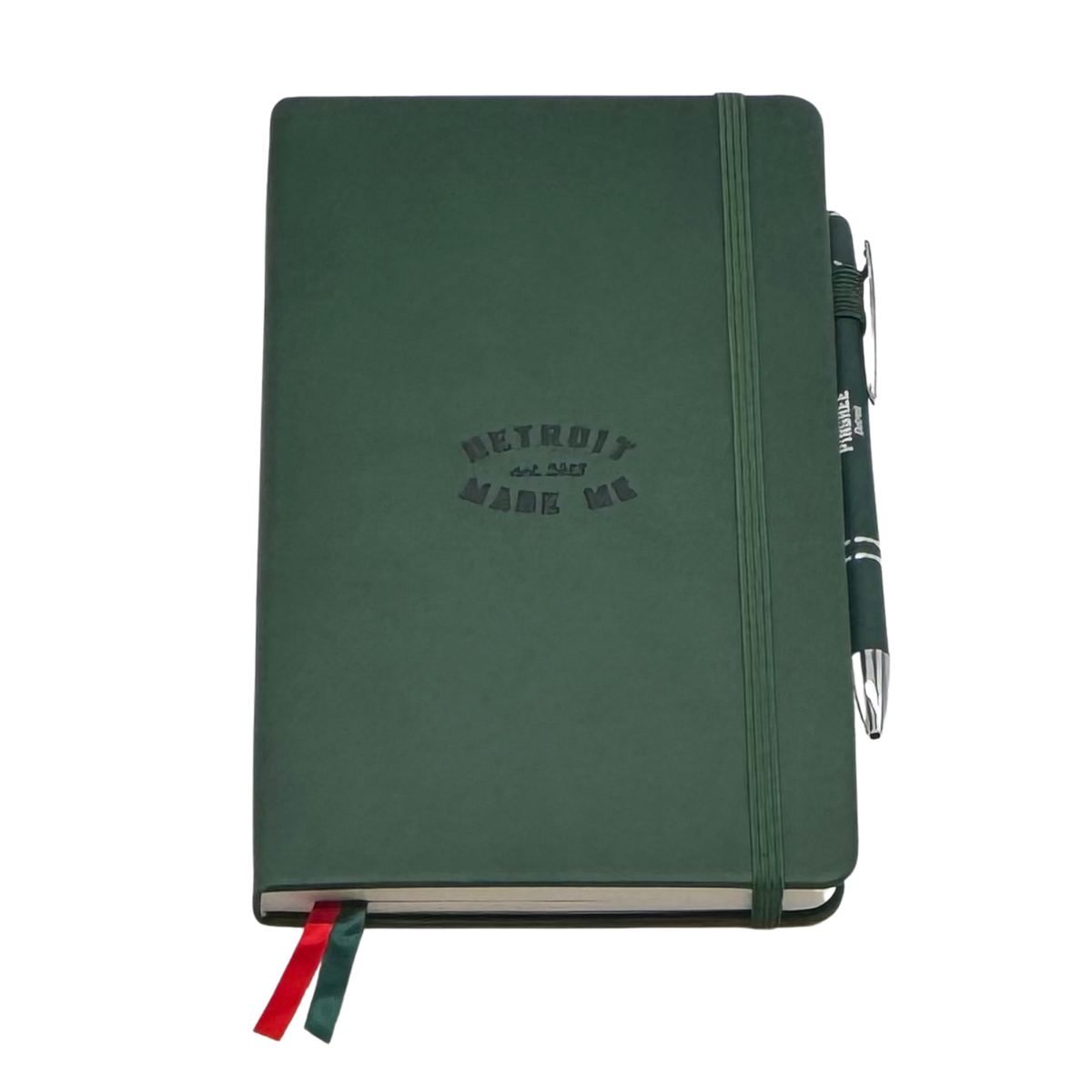 Green notebook with 'Detroit Made Me' text and a pen on a white background. Our hand assembled Journal crafted with 100% recycled paper pulp with lined pages. Detroit made me. Includes a pen, double bookmarks a front pocket and a rear pocket and elastic closure that we sew for reinforcement. A 5 size, comparable to a moleskine style, fits inside of our portfolio or works great as a standalone.
