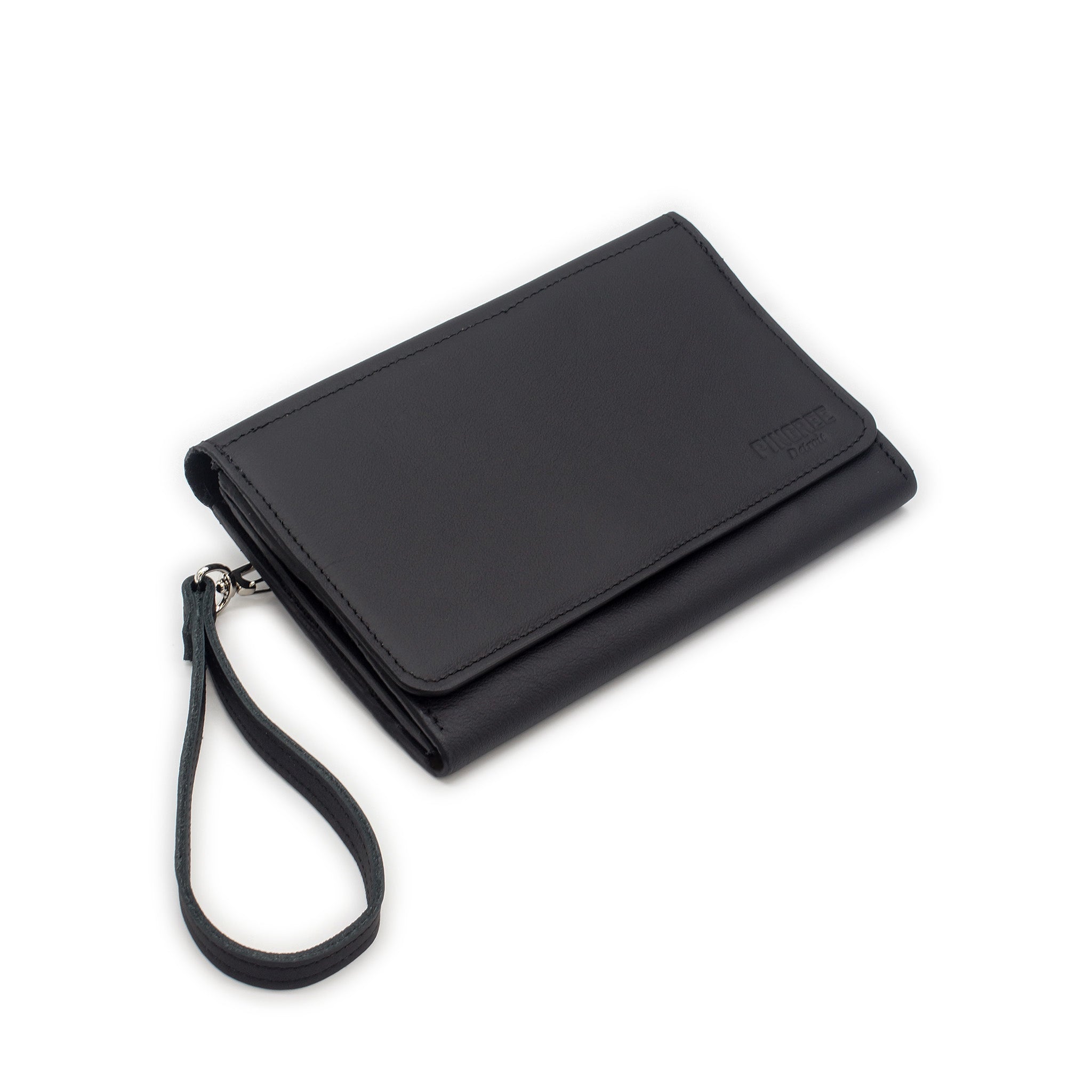 The Adeline Lux, pictured here in the front profile with all black leather, upcycled from the automotive industry, with clean rounded corners, magnetic closure, and a wristlet. This 5-in-1 bag is handmade in Detroit, MI USA, with upcycled leather from the automotive industry. Each comes with a picture of the Veteran or Detroiter who made it.