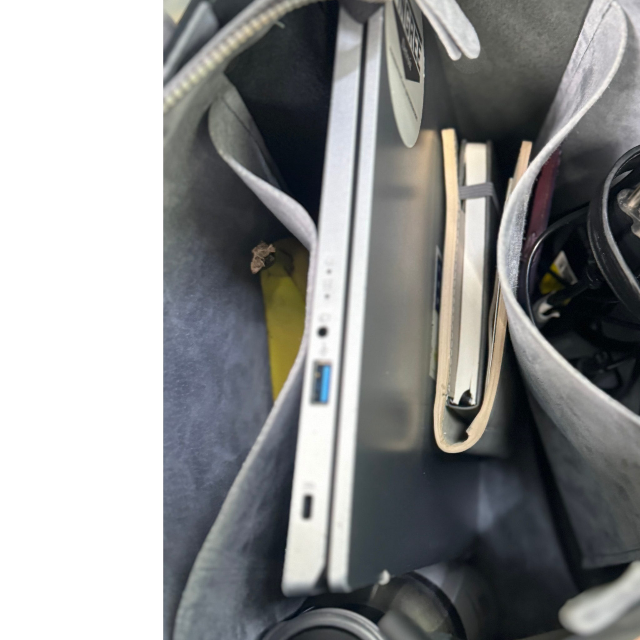 Onyx black leather bag and travel tote or work bag with a zipper and made sustainably by Pingree Detroit,
In Detroit, with upcycled leather, pictured here is the inside of the bag, holds up to a 16 “ inches laptop Made for travel or weekender bag.
