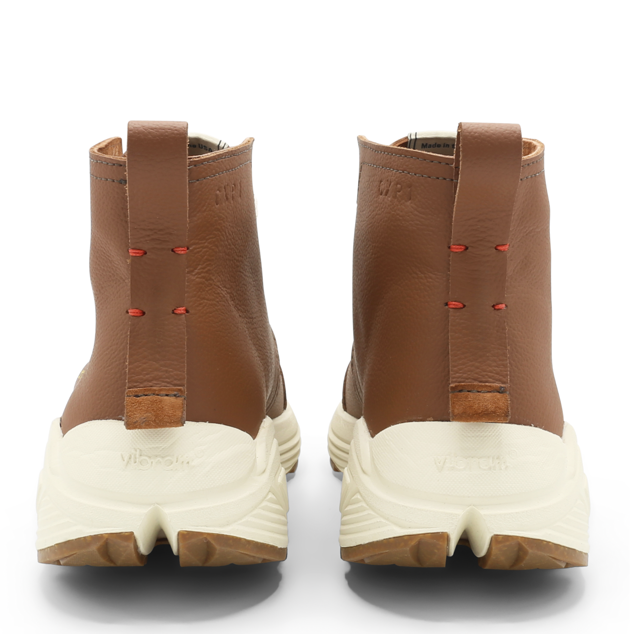 The Chukka boot pictured here from the rear has red accents that celebrate the service and sacrifice of Veterans across America and abroad. in oak tree brown is Designed and handmade collaboratively in the USA alongside @comunitymade with upcycled leather and our new Vibram ecostep sole made from recycled materials. This boot’s got the perfect mix of style, comfort, durability, and a lighter footprint on the planet.