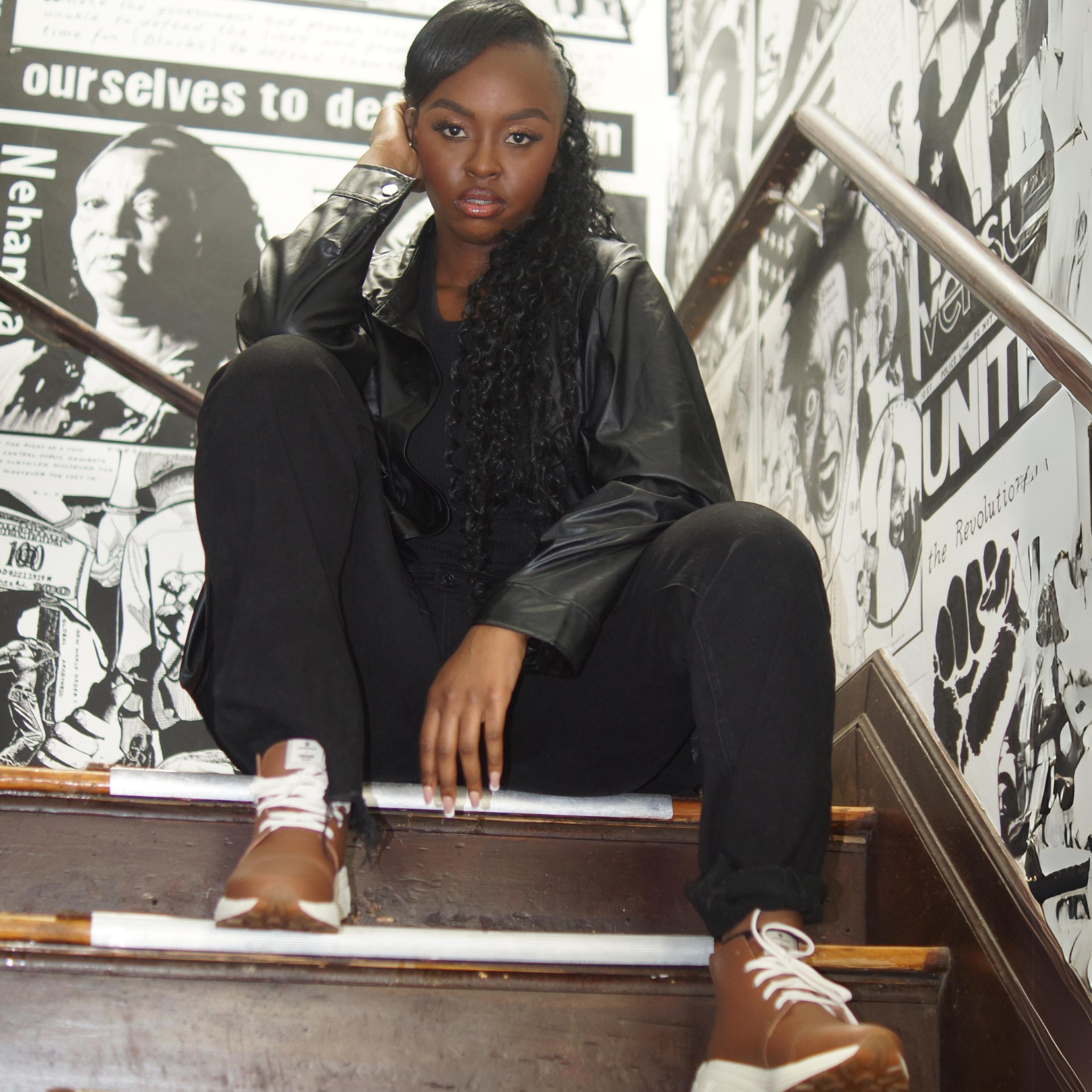 Picured in Onyx with off-white outsole. With a detroit made, american made, leather clutch and crossbody called the Adeline Lux, in front of our Chukka Boot, Designed and handmade collaboratively in the USA alongside @comunitymade with upcycled leather and our new Vibram ecostep sole made from recycled materials. This boot’s got the perfect mix of style, comfort, durability, and a lighter footprint on the planet.