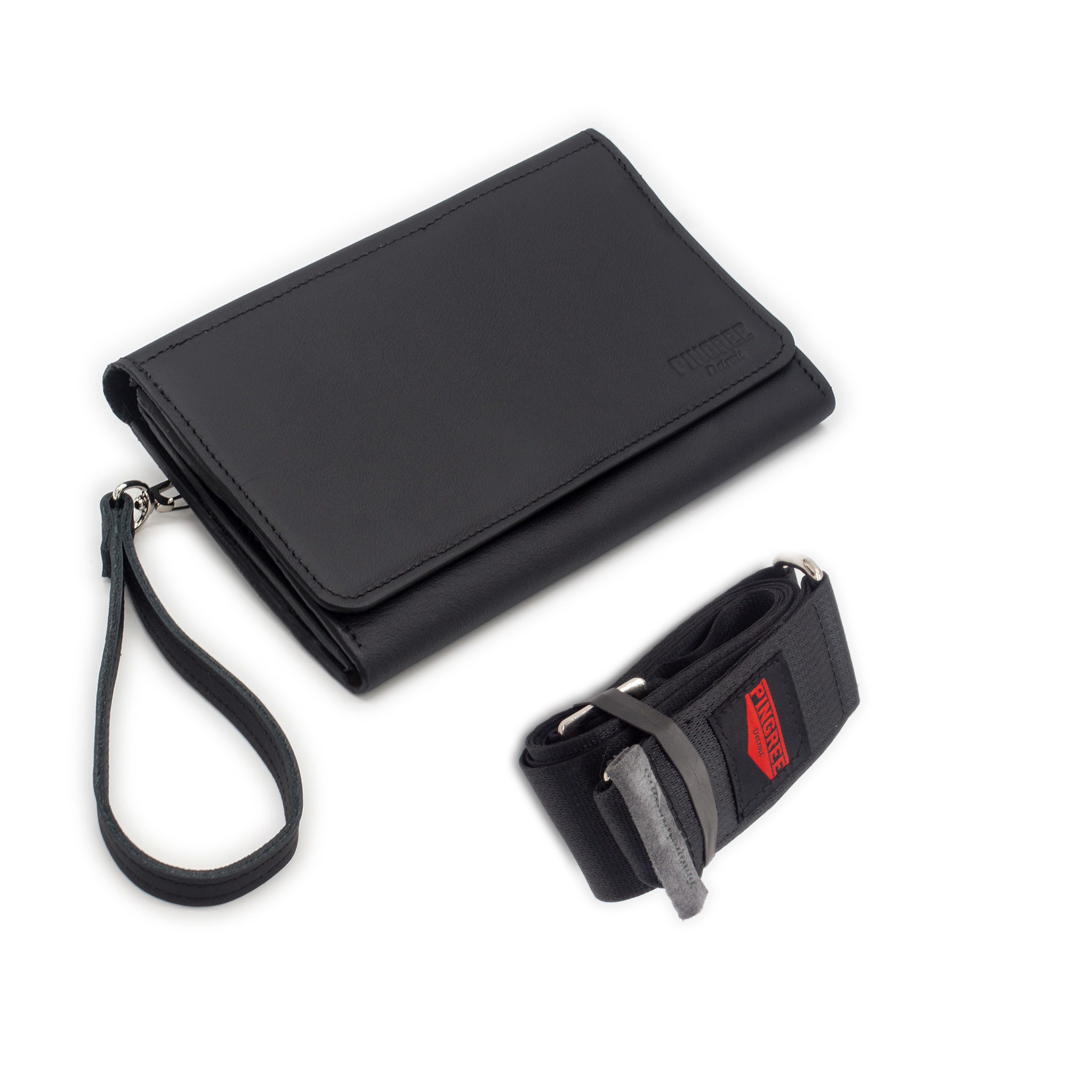 The Adeline Lux, pictured here in the front profile with seatbelt straps, a grey interior, and exterior all black leather, upcycled from the automotive industry, with clean rounded corners, magnetic closure, and a wristlet. This 5-in-1 bag is handmade in Detroit, MI USA, with upcycled leather from the automotive industry. Each comes with a picture of the Veteran or Detroiter who made it.