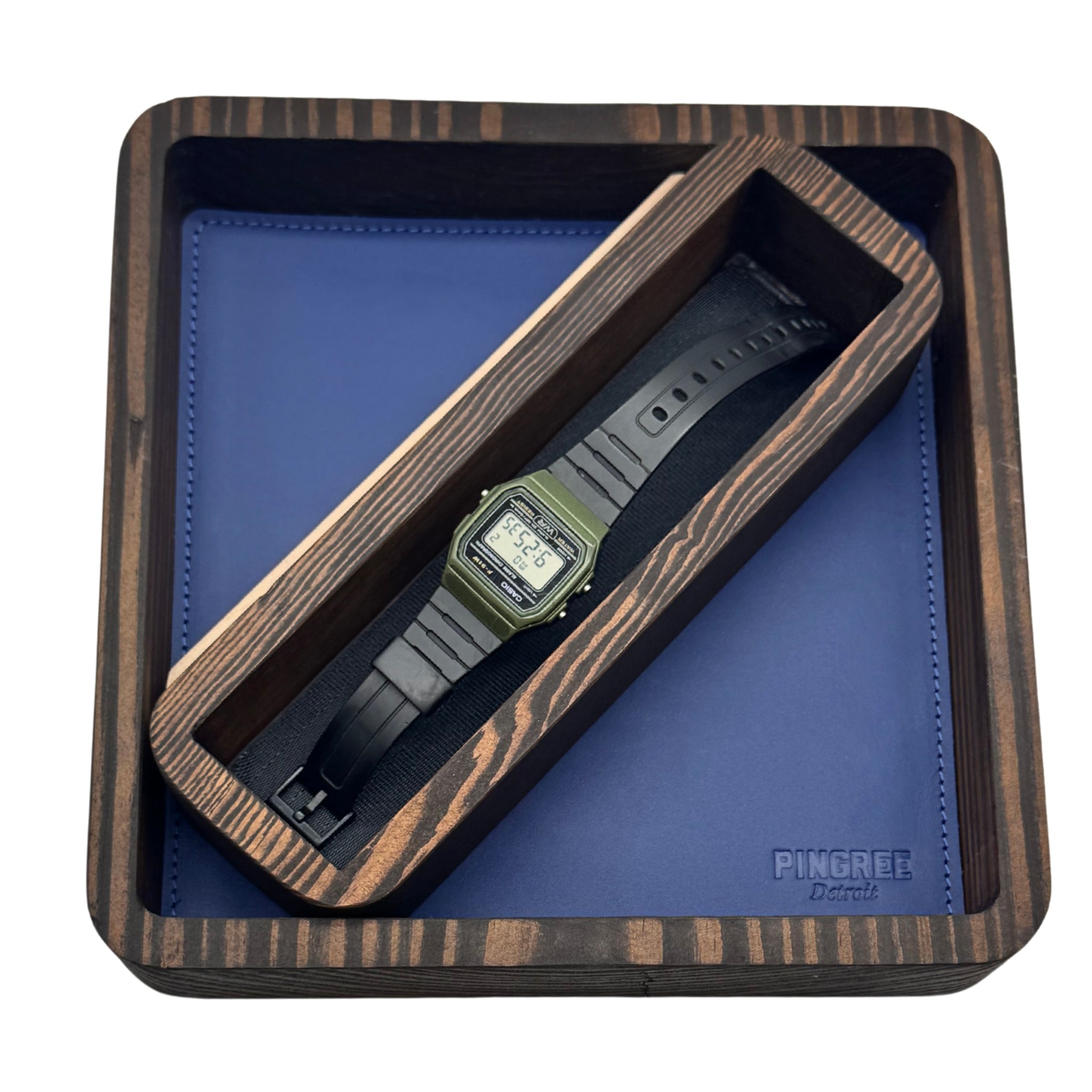Dapper modern valet tray handcrafted from reclaimed Detroit wood and car leather, designed to organize essentials like keys, watches, phones, and jewelry in your home entryway or dresser.