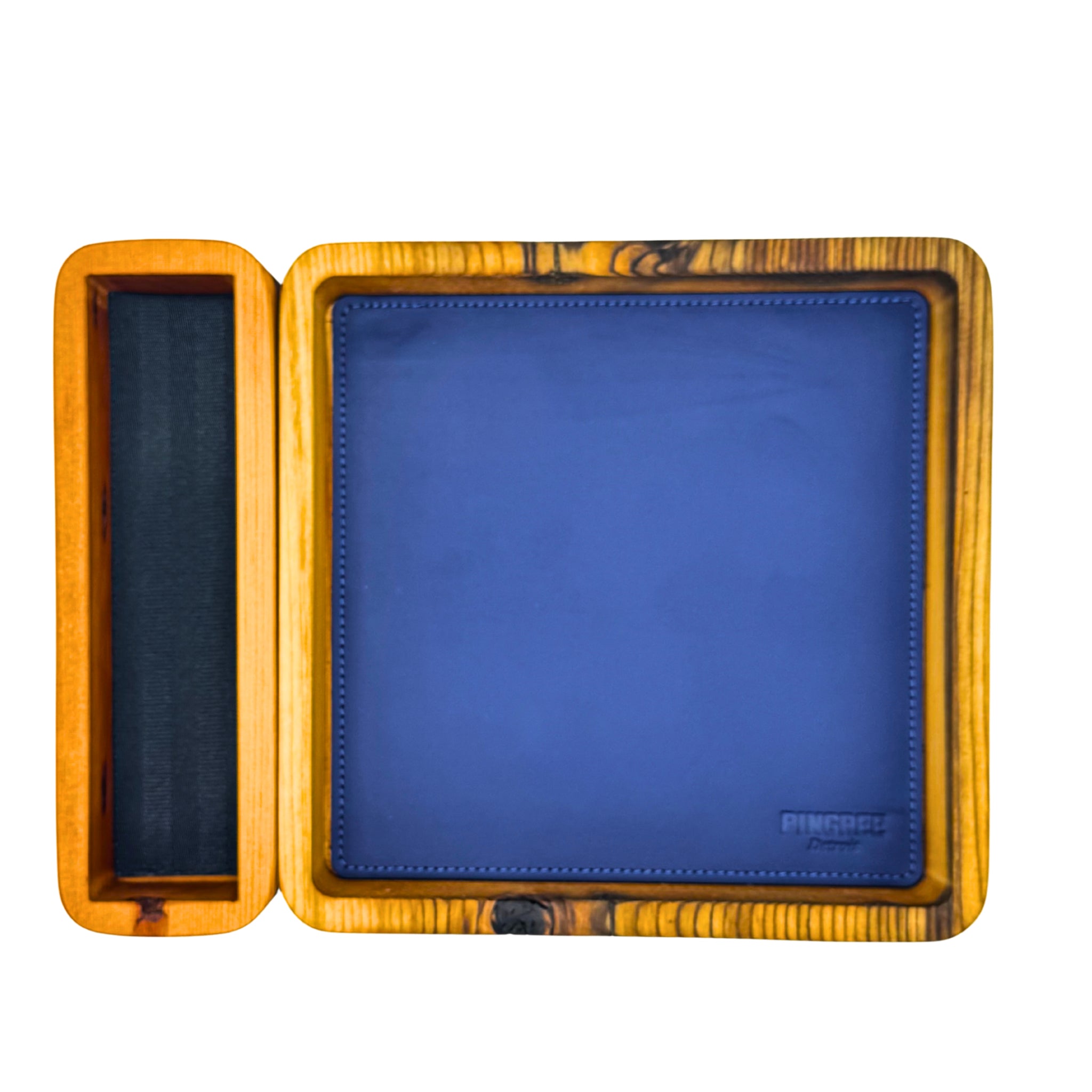 A look at our TTRPG dice tray, with the blue leather pad, removable wooden dice holder, this modular dice tray is great for during a game. Pictured here with blue removable insert, Handcrafted modular valet tray or dice tray, made in Detroit from reclaimed wood and upcycled automotive leather, featuring a removable jewelry and watch holder — perfect for home, office, or hotel organization and sustainable gift giving. Pictured here in a deep walnut brown.