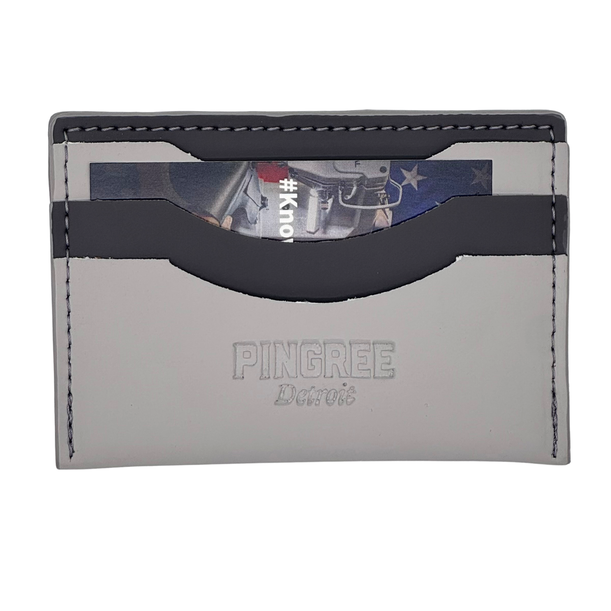 Pictured here in light gray with dark grey accents . Front profile. A leather minimalist zipper wallet with three card slots each able to hold 2 to 3 cards plus a rear zipper pouch for coins, an AirTag, a key, or lip balm.
