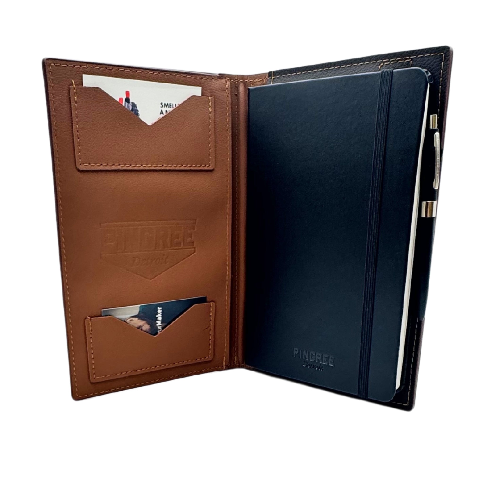 Detail of brown leather folio with brown edge paint of the Pingree Moleskin Work Folio. Sustainable leather sourcing from waste from the automotive industry. This Work folio is Made for work or for journaling or for business or for school. It’s a WORK folio made in Detroit for work and hold a small size table tablet. Pen included.