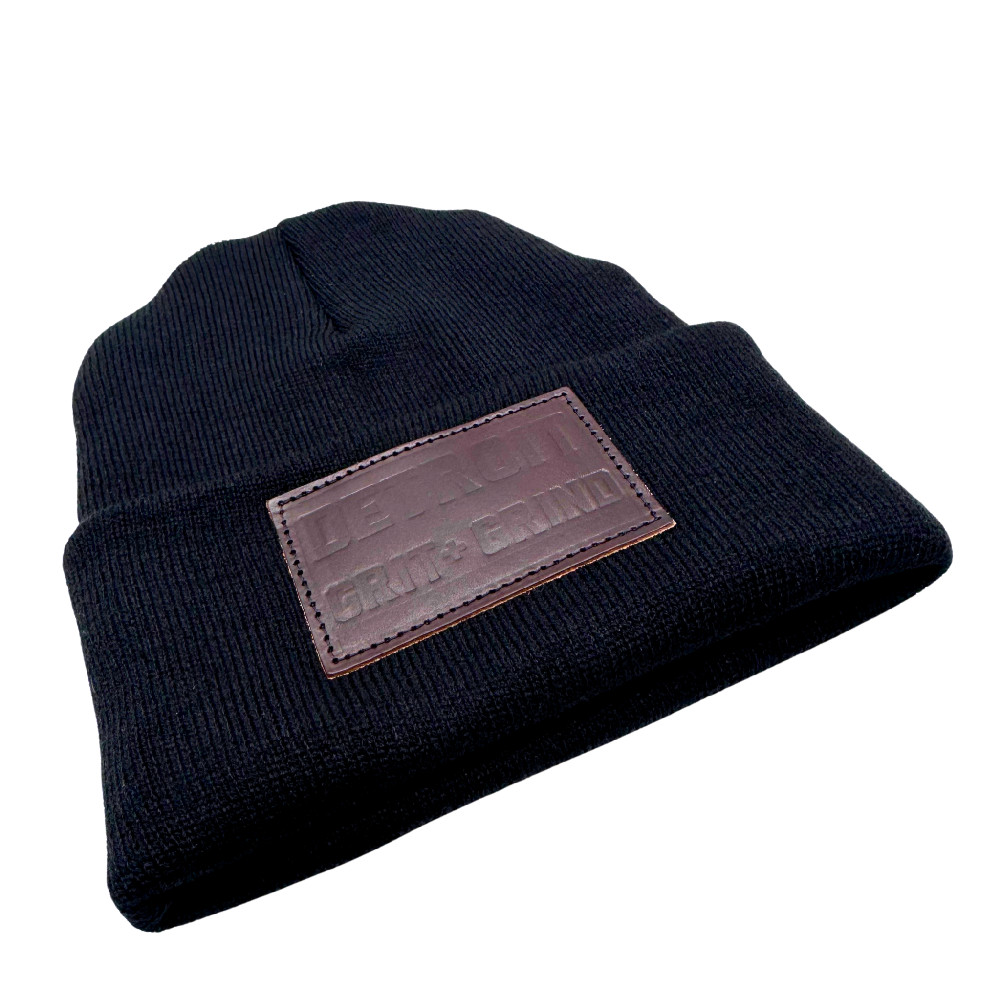 3D knit hats made in Detroit with upcycled yarn. Hand sewn and made with zero waste. Pictured here in Onyx black, with leather “ Detroit grit and grind” leather patch. A cozy warm winter hat made in the USA.