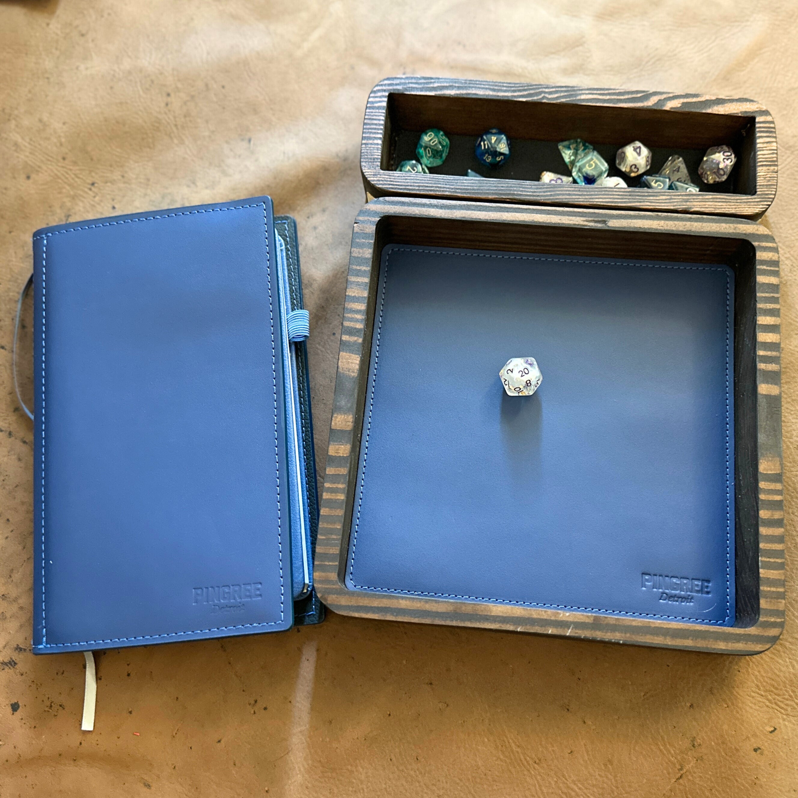 A look at our TTRPG dice tray, modular dice tray during a game. This is a DnD accessories for
Dungeons and Dragons tray,
RPG dice organizer
custom dice tray handmade
upcycled leather gaming gear
eco-friendly TTRPG accessories
tabletop RPG tray
handmade DnD gear