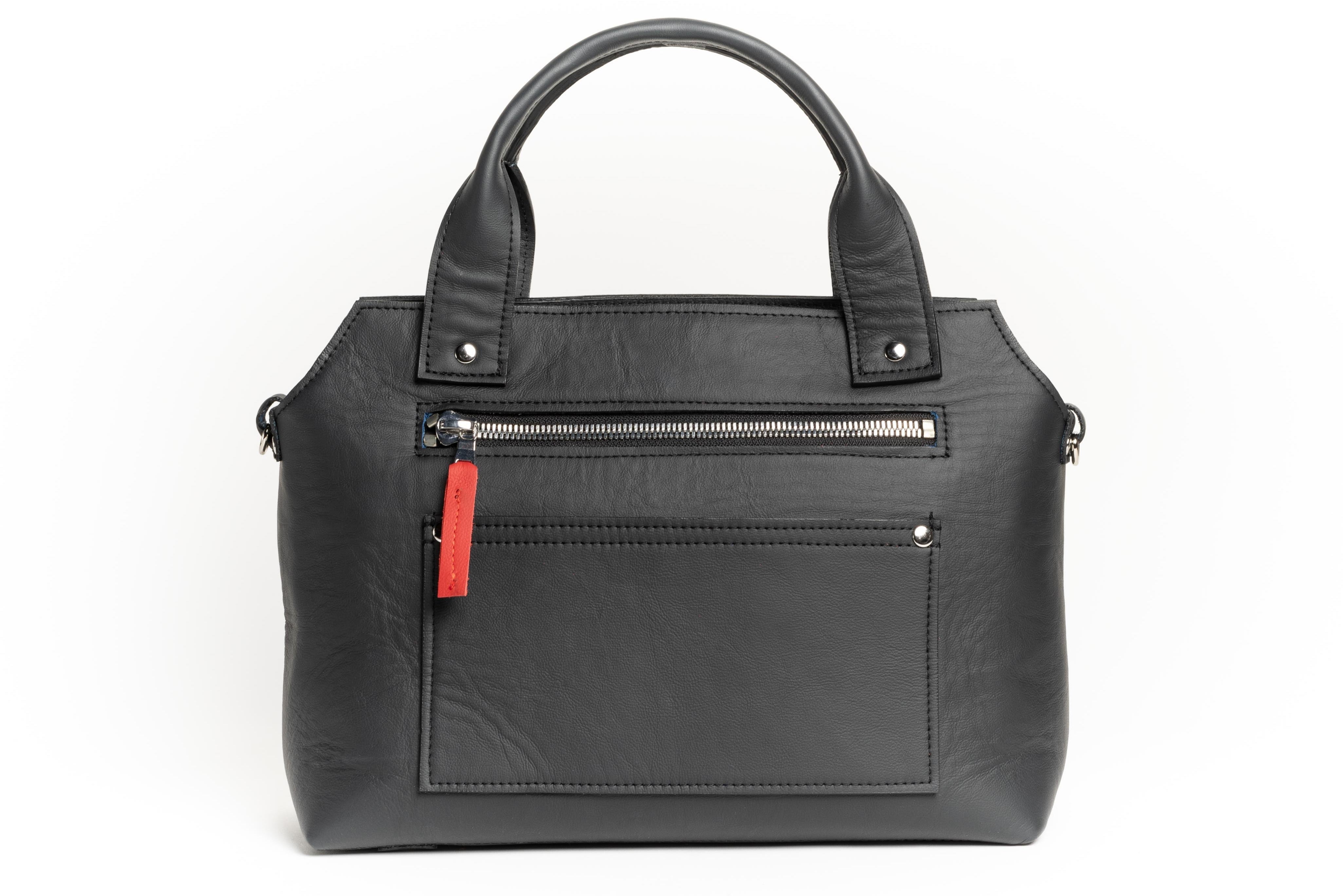 Zipper pockets for Beaubien Cross-body bag made sustainably from upcycled automotive leather in Detroit, MI.