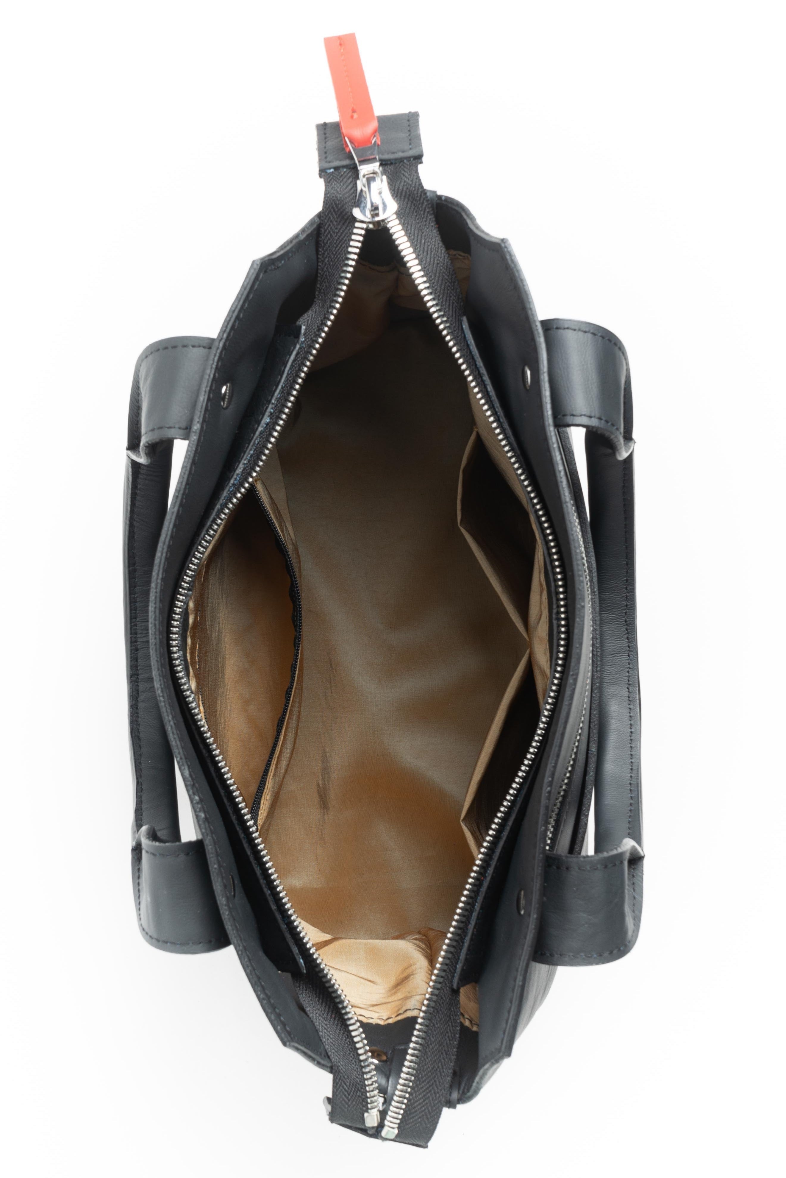 Interior view of the gold liner of the Pingree crossbody purse bag. American made hardware and repurposed automotive leather.