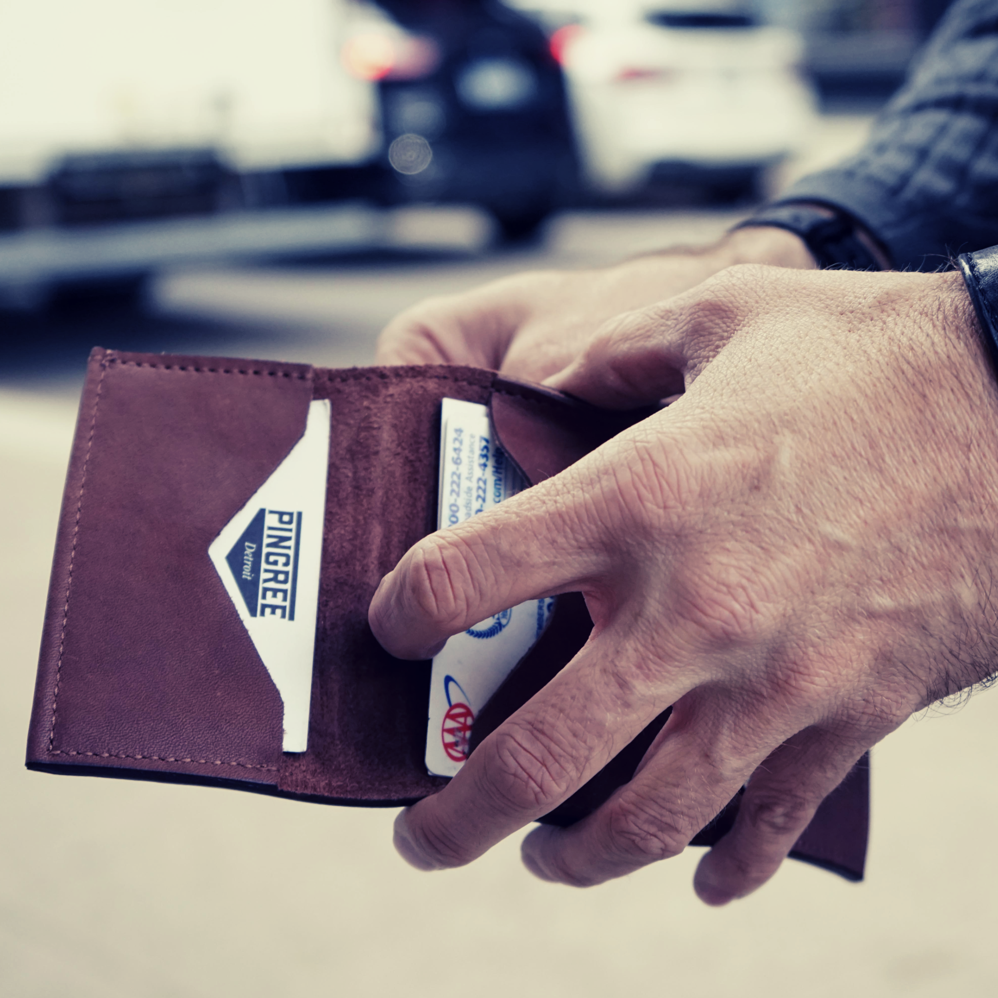 handmade leather wallet with a space for cash and 3 card slots that each hold 4-6 credit cards. all handmad eby US Veterans and Detroiters with upcycled leather.