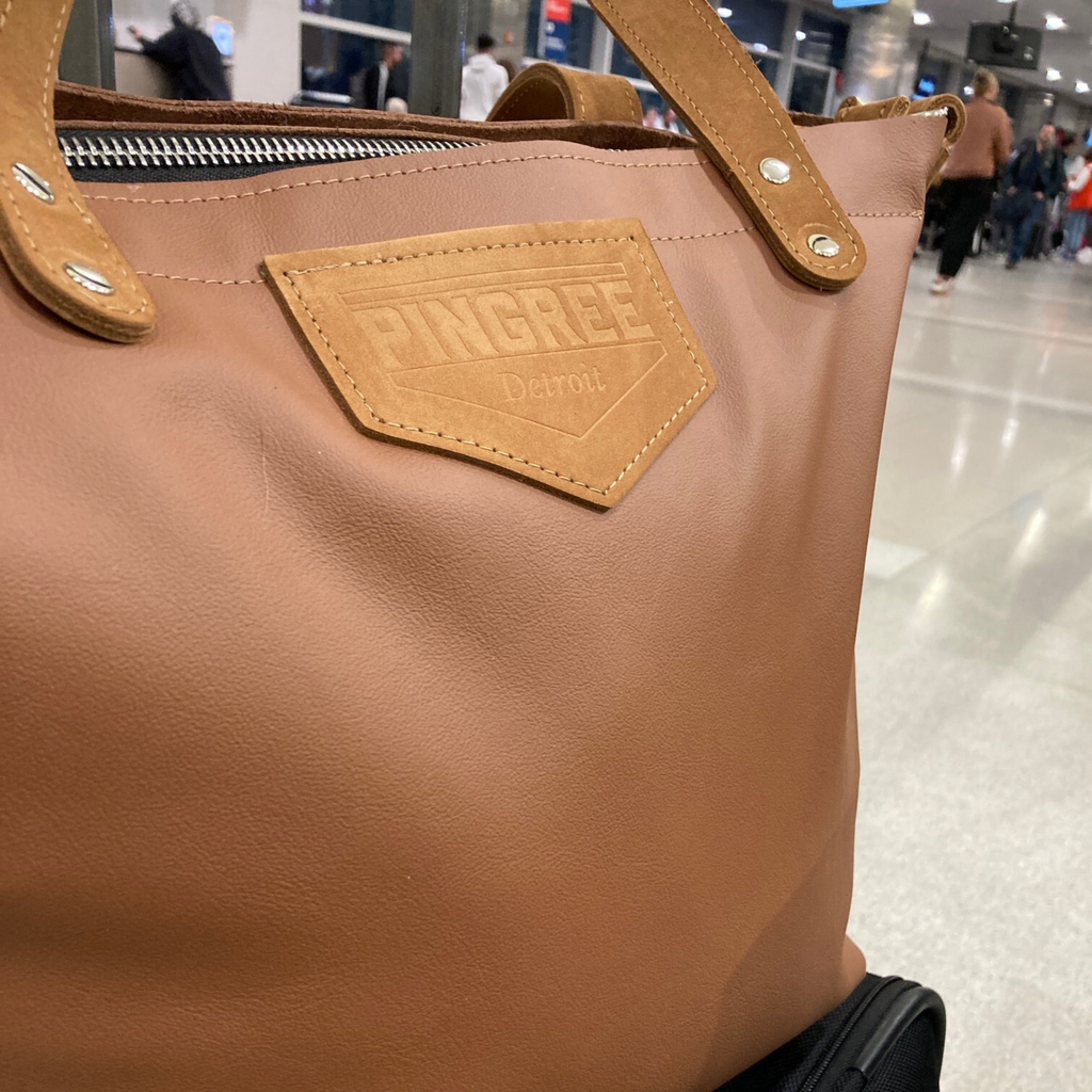 M! work and travel tote at the Air port waiting for a flight with this carry-on. 