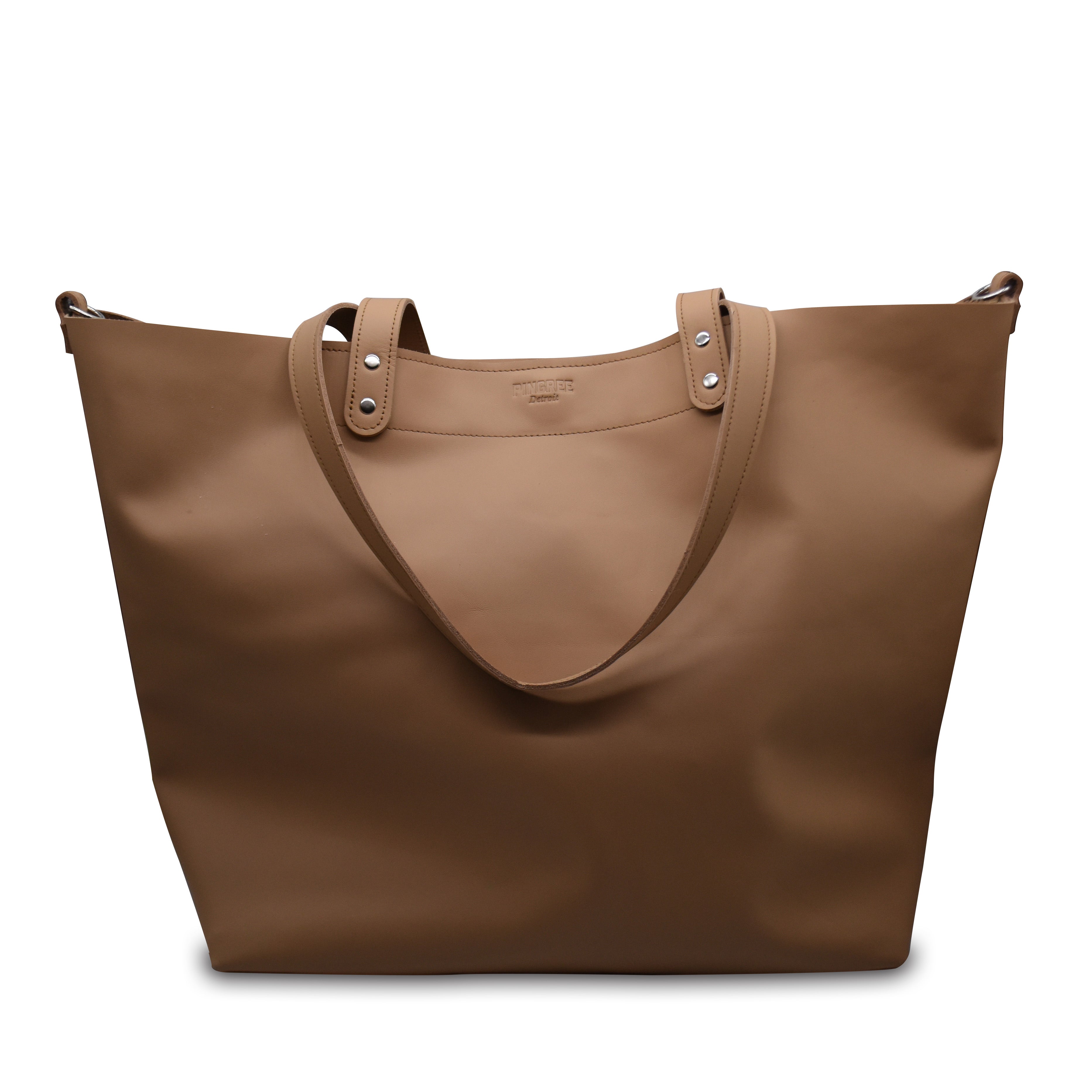 Close up of the logo on the 313 shopper bag made in Detroit. Tote bag Made by Pingree Detroit in the USA. Hardware American made. Stitching also military grade thread. Handmade by Veterans and Detroiters with new upscaled automotive leather. 