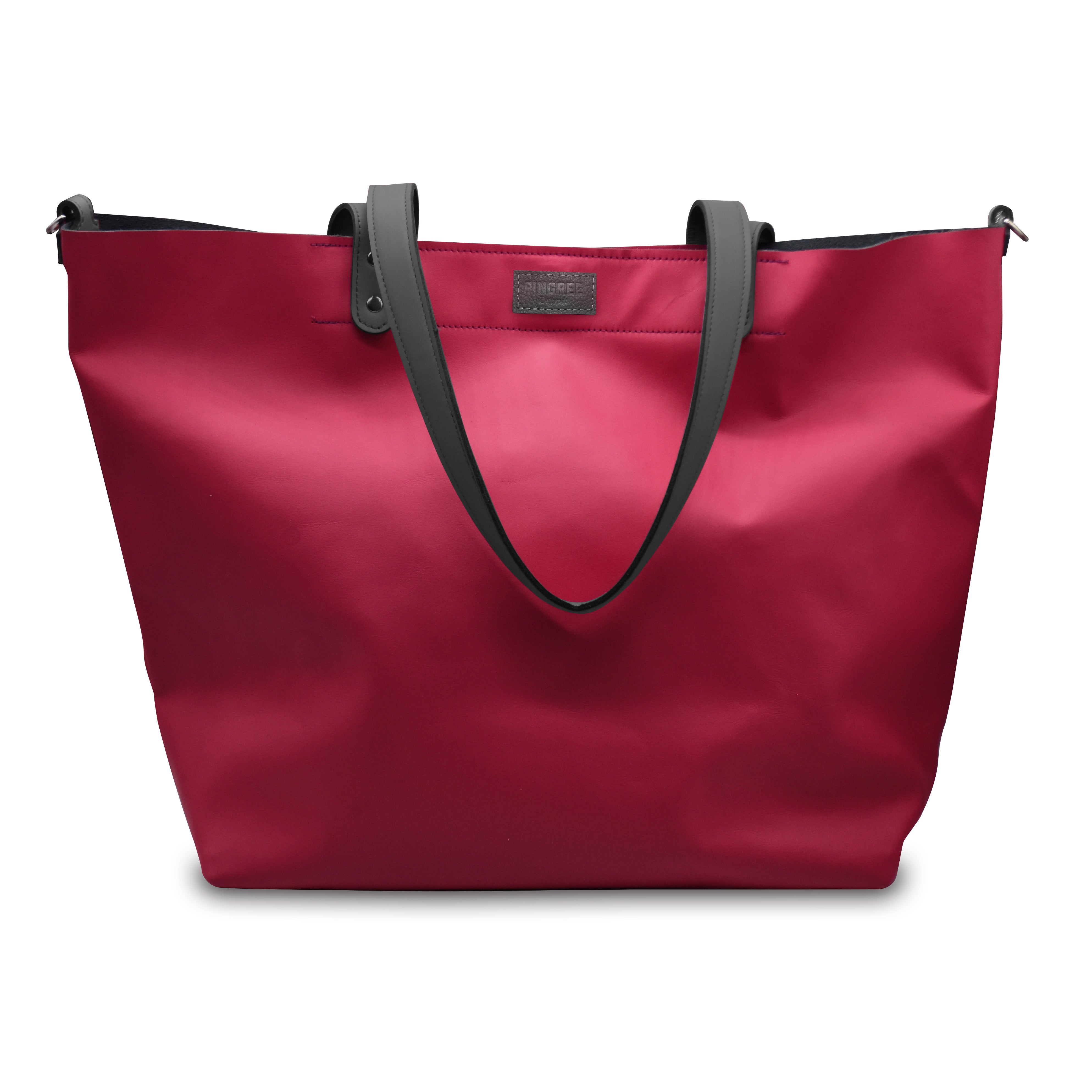 Close up of the logo on the 313 shopper bag made in Detroit. Tote bag Made by Pingree Detroit in the USA. Hardware American made. Pink color with slate grey logo and straps. 