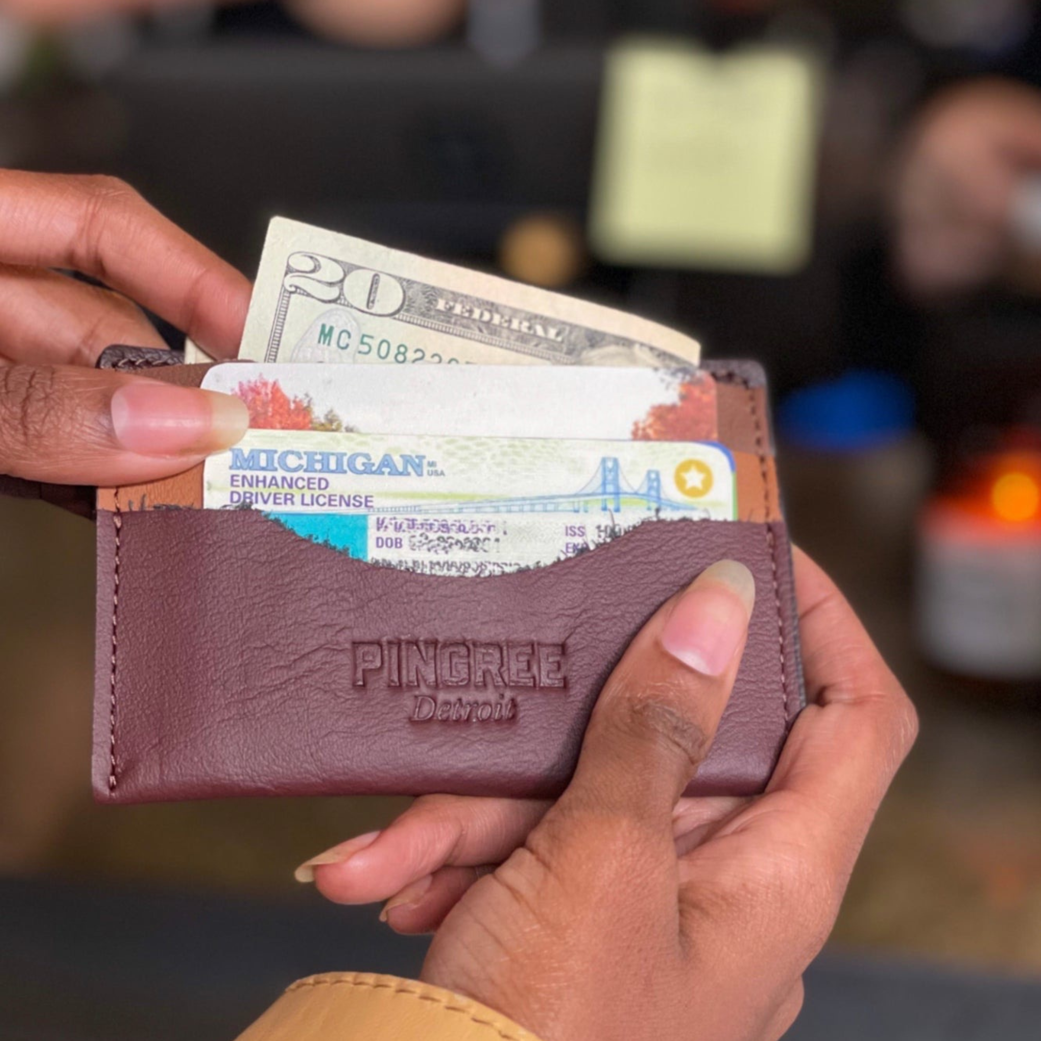 A simple, minimalist, durable, leather wallet that holds up to 8 credit cards and includes a rear zipper. Cash fits perfectly folded once in the top slot. All materials are upcycled from the automotive industry or American-made.