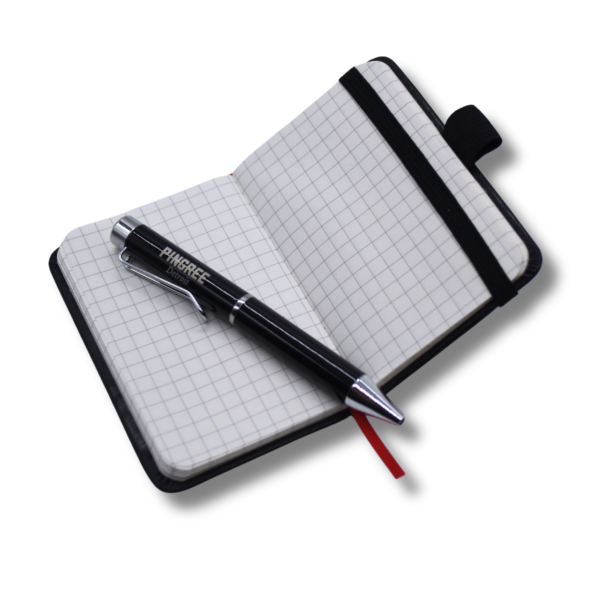 Grid notebook with a pen on a white background. 100% recycled paper