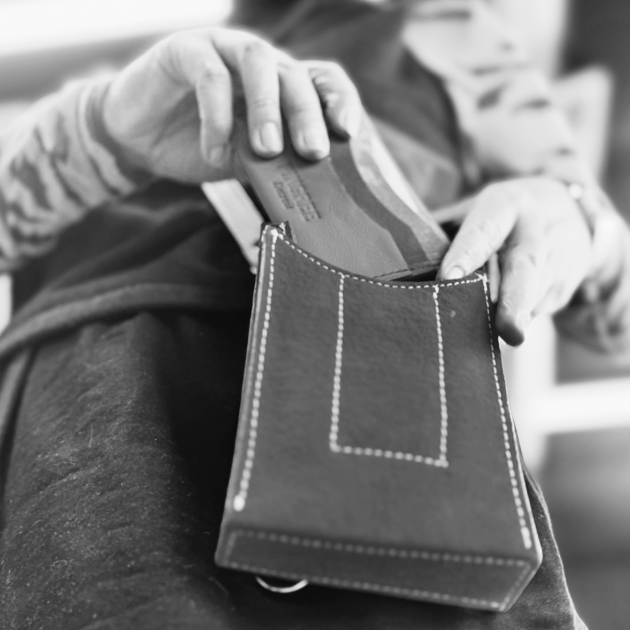 The Motown venue bag, here in the onyx color with a seat belt strap. a pouch sized to get into any sports, stadium, concert venue, and performance hall. 4” x 6” x 1.5” and available in 3 colors. Handmade by Veterans and Detroiters with upcycled leather from the auto industry. Available with a leather strap or a seatbelt strap.