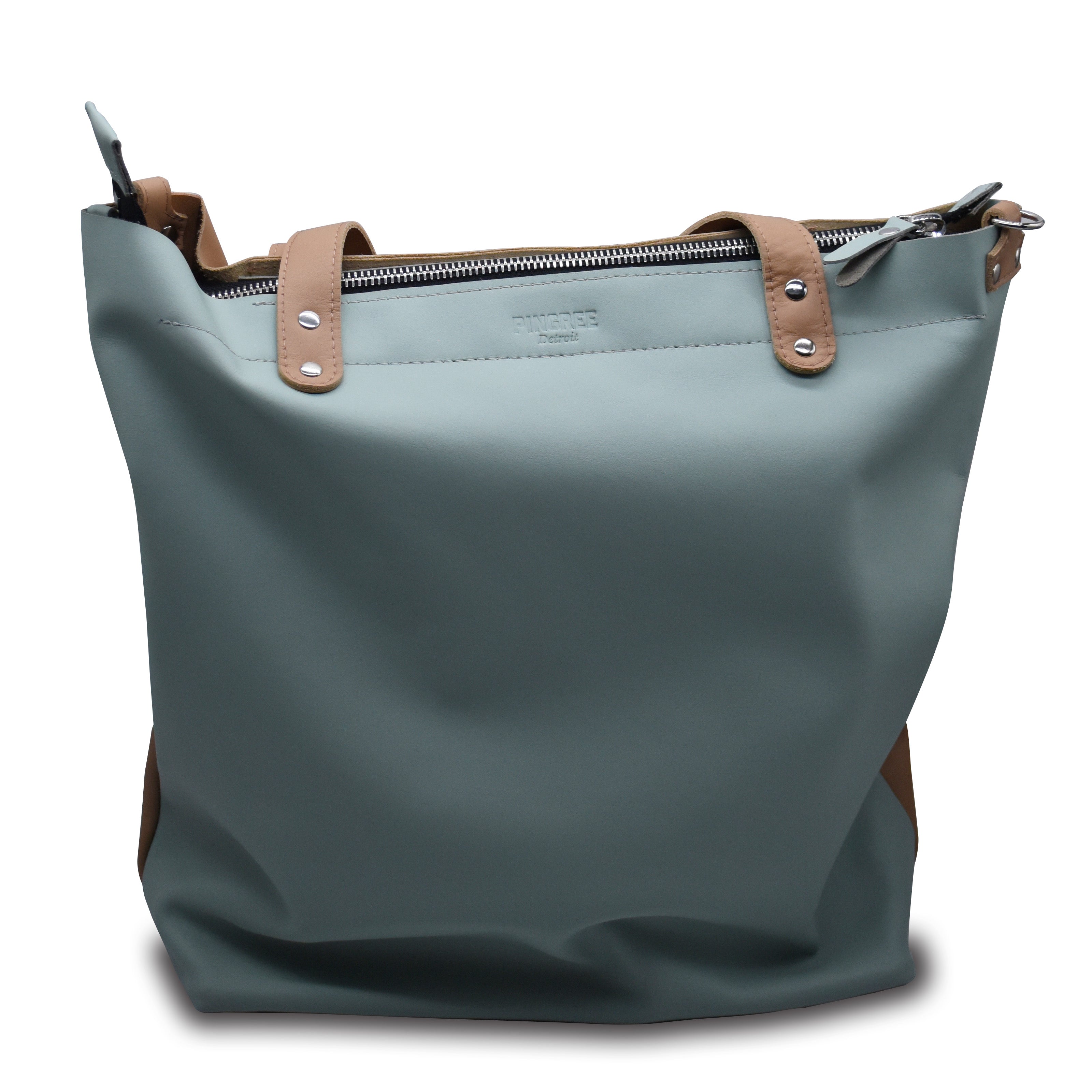 Mint green tote bag with brown leather straps on a white background