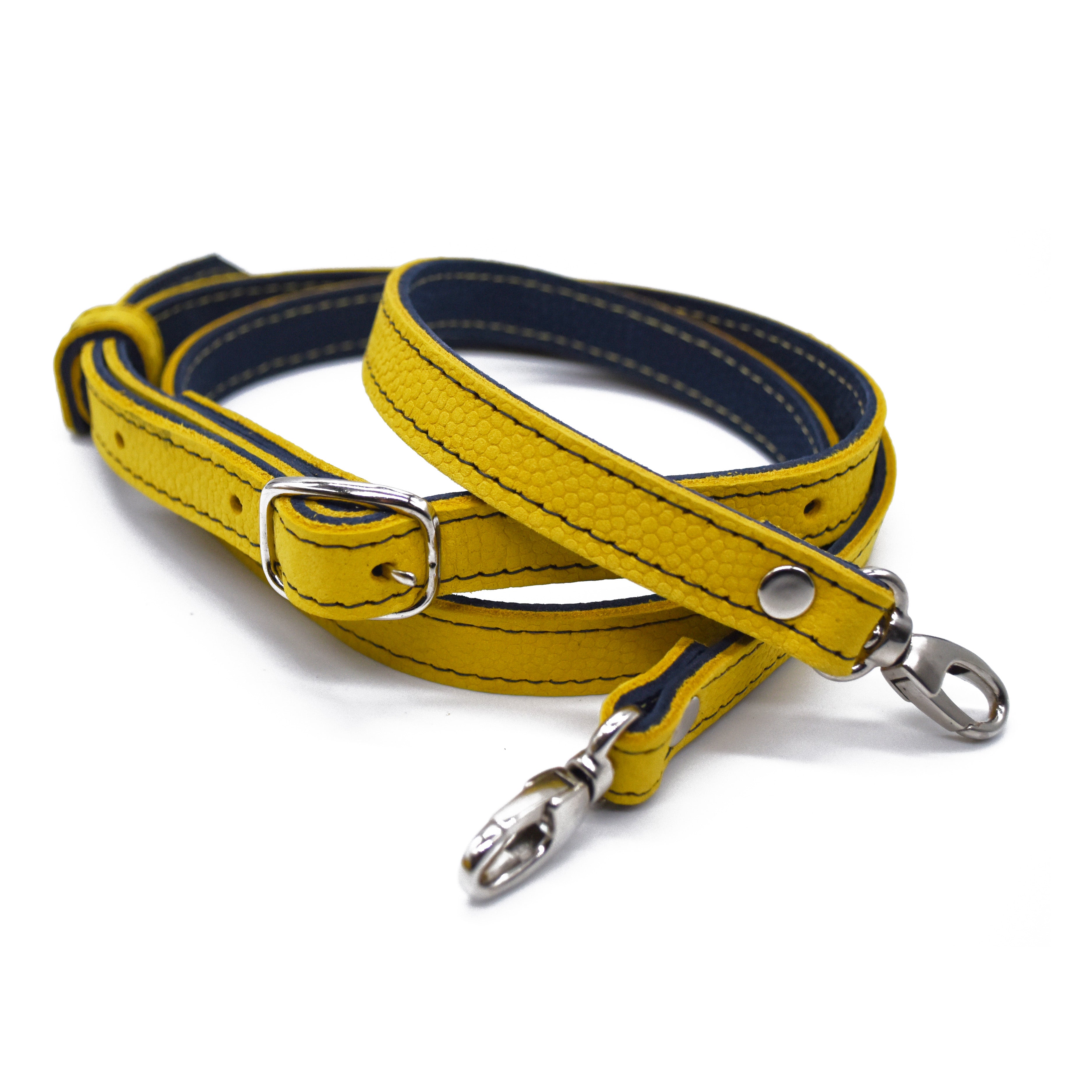 Yellow leather strap with blue accent on a white background