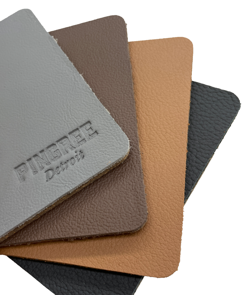 Assorted Leather Corktown Coasters manufactured in Detroit from sustainable materials