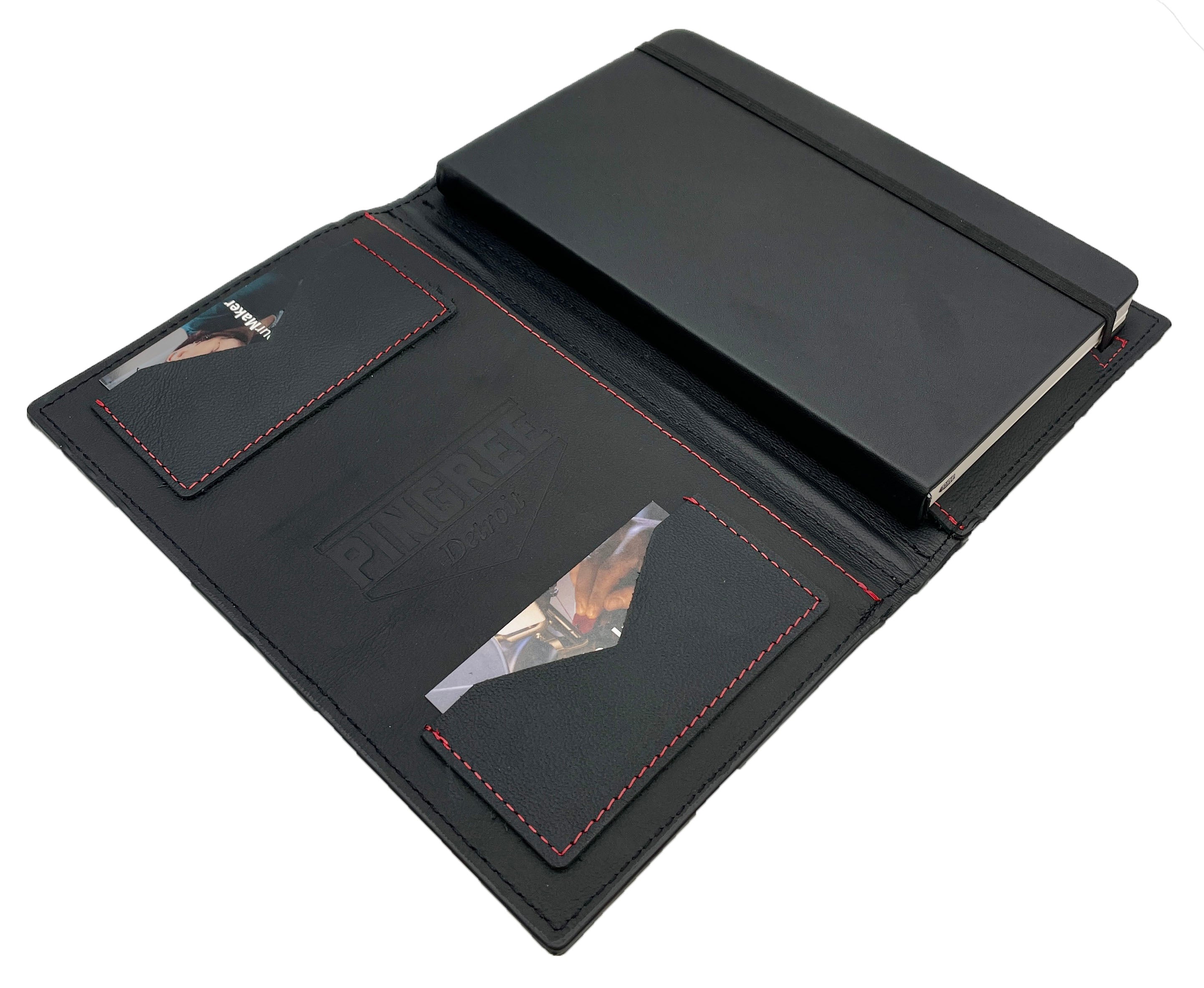 Inside Pingree Work Folio displaying 2 pockets and Moleskine journal. Manufactured in the USA from upcycled automotive leather.