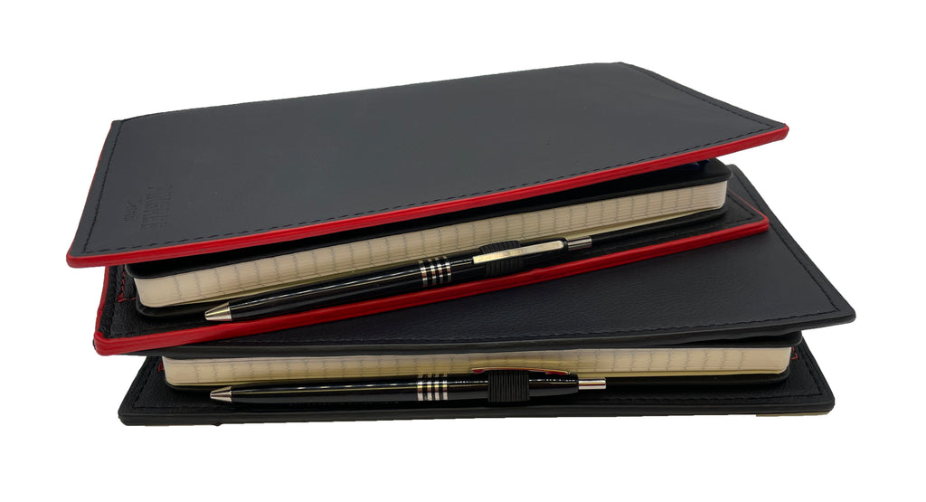 Pingree Moleskine Work Folios stacked, with Skillcraft pens. All leather sustainably sourced from waste of the automotive industry