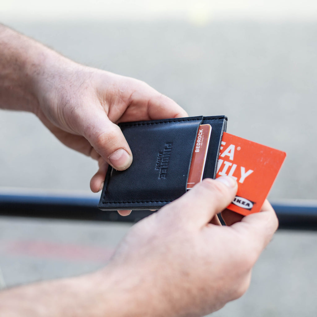 Pingree's slim wallet full of cards. Made in the USA by veterans and Detroiters. All leather sourced sustainably from upcycled leather from the automotive industry.