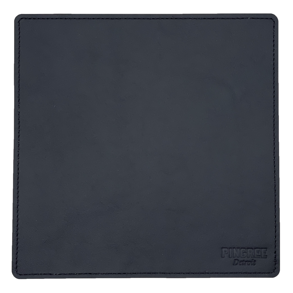Pingree’s mouse pad in onyx manufactured from ecofriendly repurposed automotive leather.