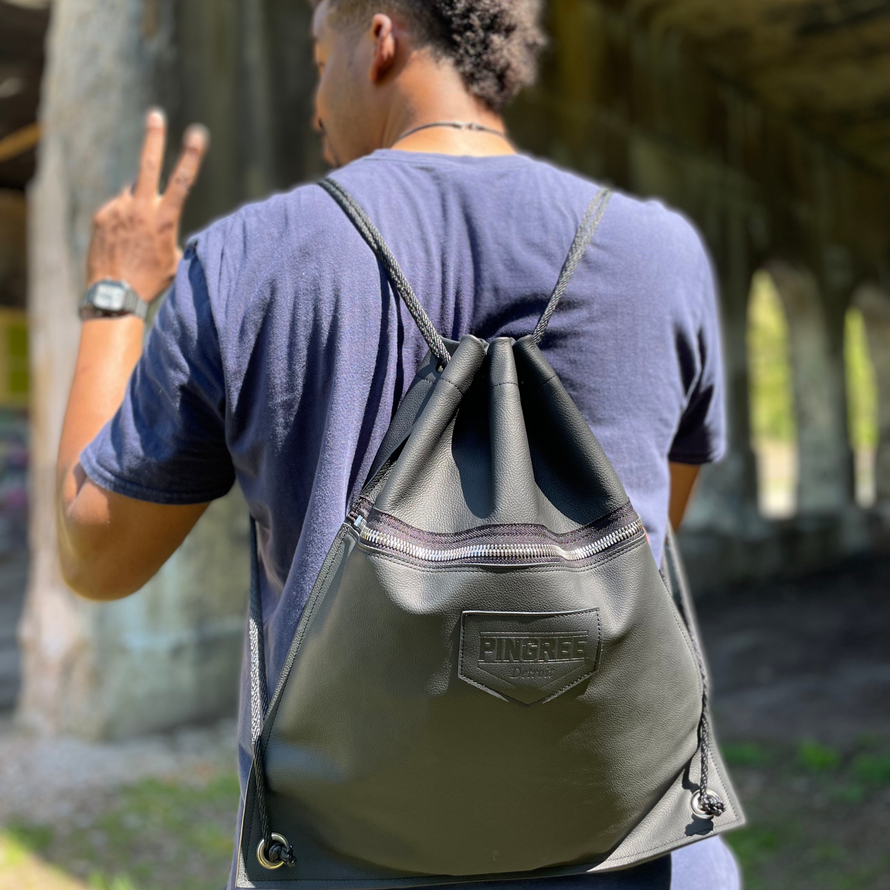 leather backpack with drawstrings made with upcycled leather in black. Handmade in Detroit , USA